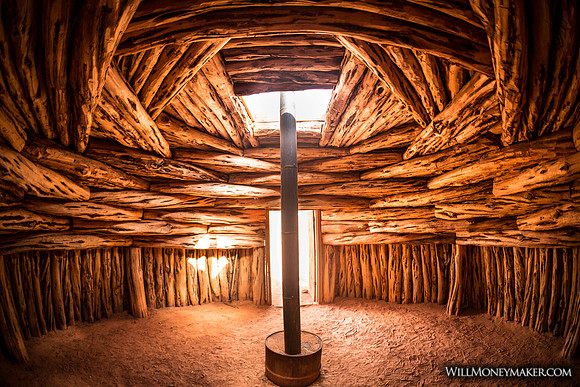 Interior of a "male" style Navajo hogan, with a stove made from a 55 gallon drum